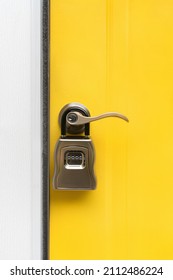 Photograph of a Real Estate Combination Lockbox placed on the handle to a front door of a home with copy space