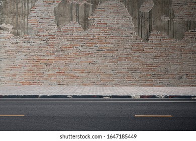 A photograph of road on an old brick wall. - Shutterstock ID 1647185449