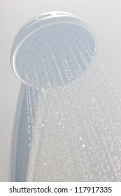 Photograph Of A Shower Head Showing Drops With Streams Of Hot Water. Black And White Photo Taken In Steam