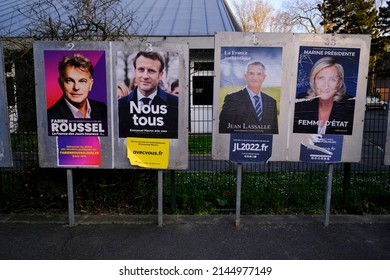 A photograph shows campaign posters of candidates for the 2022 presidential election, outside of a polling station in Lille, France on April 9, 2022.