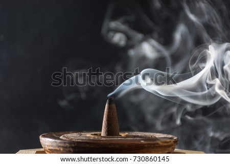 photograph of smoke caused by various incenses on black background