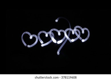 Photograph Of Some Hearts Drawing Made With Long Exposure Light Effect