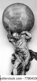 Photograph Of A Statue Of Atlas Holding Globe.