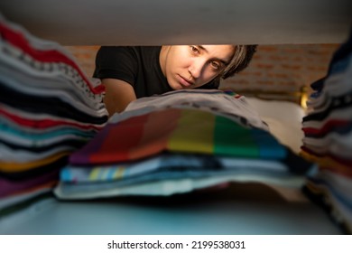 Photograph Taken From Inside The Closet And Woman Organizing Clothes