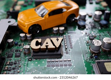 A photograph that expresses the image of a Connected Autonomous Vehicle using a motherboard. - Shutterstock ID 2312046267