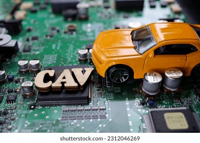 A photograph that expresses the image of a Connected Autonomous Vehicle using a motherboard. - Shutterstock ID 2312046269