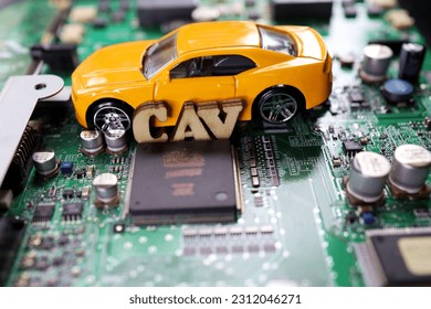 A photograph that expresses the image of a Connected Autonomous Vehicle using a motherboard. - Shutterstock ID 2312046271