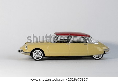 Photograph of toy model car against white background.