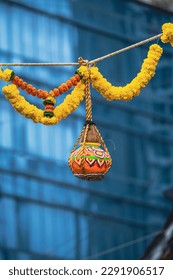 photograph of traditional dahi handi or Matka (earthen pot) tied up high on the Gokulashtami festival which is Lord Shri Krishna's birthday. Indian youth form a human pyramid to break the Dahi Handi