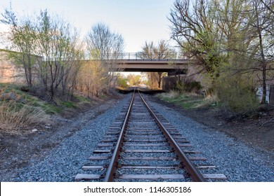 Photograph of train tracks under an overpass in Pleasant Grove, Utah.
