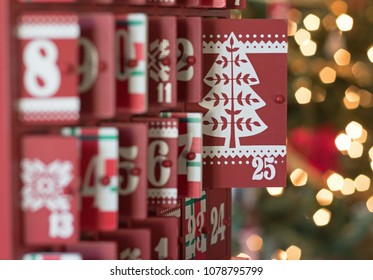 Photograph of a Wooden Advent calendar with the focus on door 25