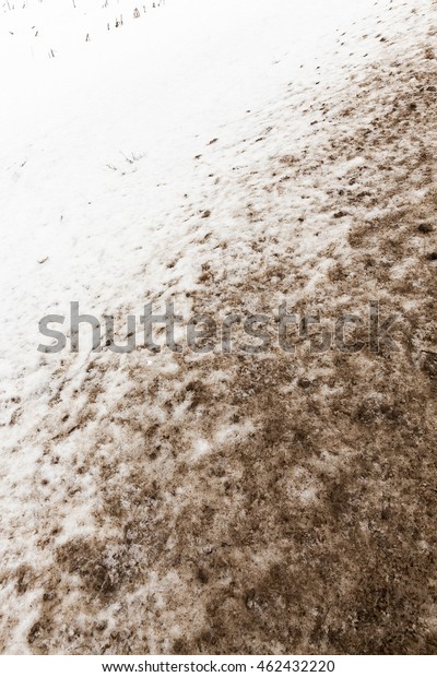   photographed close-up of the road for the\
movement of vehicles covered with snow, winter season, countryside,\
empty roadway,
