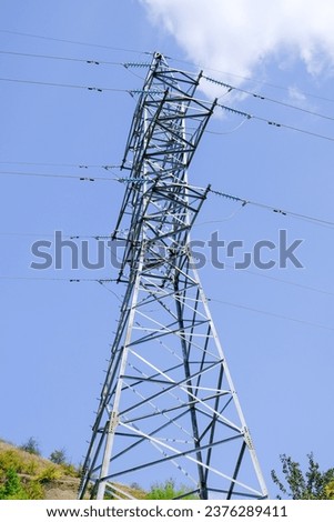  photographed electric industrial poles situated in the daytime 
