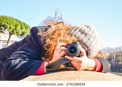 Photographer Blonde Woman Holding DSLR Camera Taking A Photograph