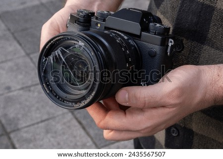 
Photographer and broken lens uv filter