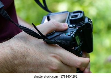 Photographer is checking the screen of his camera - Powered by Shutterstock