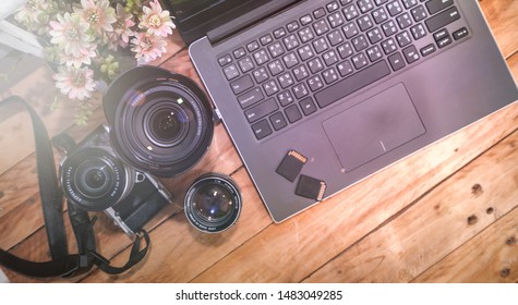 Photographer Concept Topview Of Work Space Photographer With DSLR Camera Lense And Computer Laptop On Wooden Table