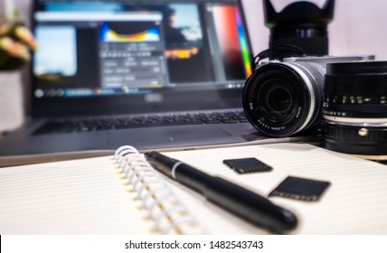 Photographer Concept Work Space Photographer With DSLR Camera Lense And Computer Laptop