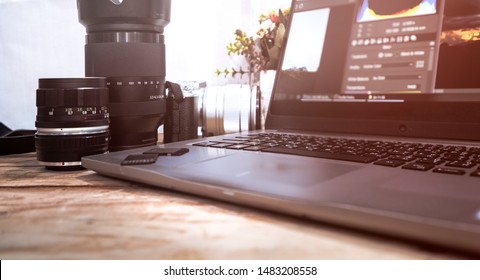 Photographer Concept Work Space Photographer With DSLR Camera Lense And Computer Laptop