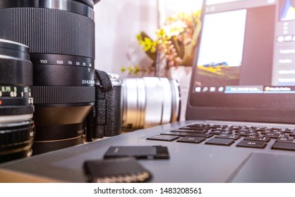 Photographer Concept Work Space Photographer With DSLR Camera Lense And Computer Laptop