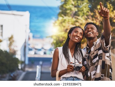 Photographer Couple On Summer Vacation Or Holiday Abroad And Tourism With Lens Flare, Ocean And Street Background. Black People, Man And Woman Looking At Tourist Destination For Travel Photography