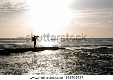 photographer during sunset