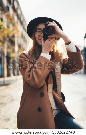 Long hair girl with hat and sunglasses walking in Sydney city streets in Australia.