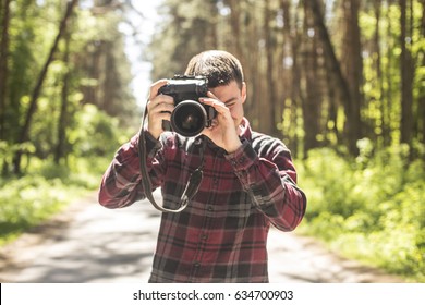 Photographer at a happy sunny day outdoor photo session