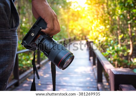 photographer holding his camera.