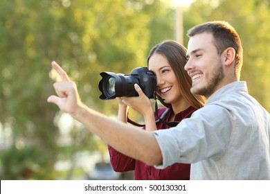 Photographer Learning In A Photography Course Outdoors Listening The Teacher Explanation