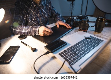 photographer man hand graphic tablet on desk - Shutterstock ID 1633387441