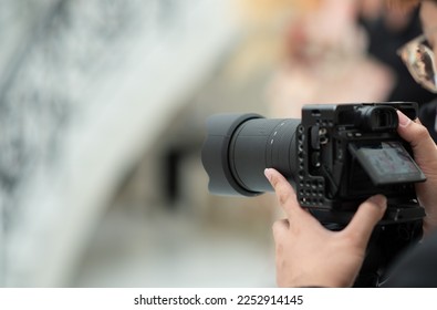 photographer, man using camera, professional - Shutterstock ID 2252914145