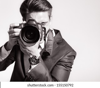 Photographer Man Is Using Professional Camera