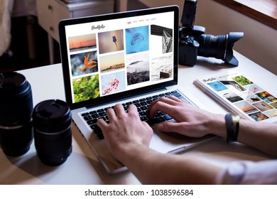 Photographer Managing His Online Portfolio