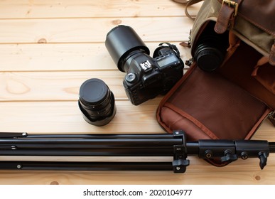 Photographer pack his camera and lenses to backpack. Bag appliances for photography.