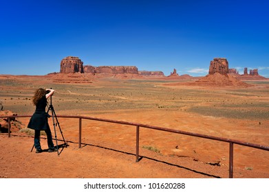 Photographer At Scenic Monument Valley Overlook