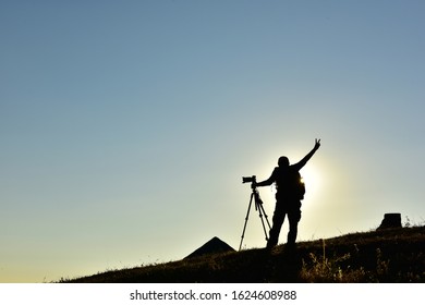 The photographer stood to photograph the mountain on a high hill during the day time. - Shutterstock ID 1624608988