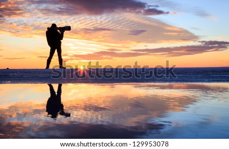 A photographer in sunset