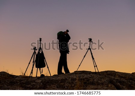 Similar – Silhouette der Fotografen auf den Bergen