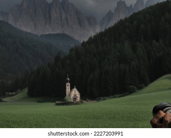 photographer taking picture of ranui church in south tyrol funes valley dolomites italy view