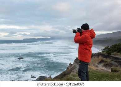 Photographer Is Taking Pictures Of The Beautiful Seaside View On The Oregon Coast. Taken In Cape Kiwanda, Pacific City, During A Cloudy Winter Sunsrise.