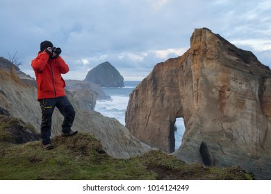 Photographer Is Taking Pictures Of The Beautiful Seaside View On The Oregon Coast. Taken In Cape Kiwanda, Pacific City, During A Cloudy Winter Sunsrise.