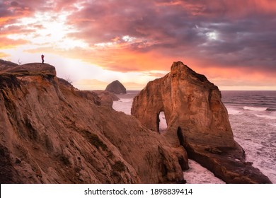 Photographer Is Taking Pictures Of The Beautiful Seaside View On The Oregon Coast. Taken In Cape Kiwanda, Pacific City, During A Cloudy Winter Sunrise.