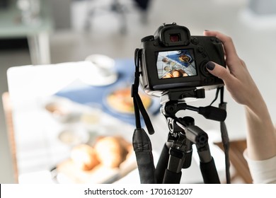 Photographer Taking Pictures Of Food And Drinks. Female Ready To Taking Photos On Camera For Food Styling, Carema On Tripod