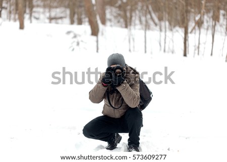 Similar – Foto Bild Ein Mann in winterbekleidung spielt Elefant und formt seine Arme zu einem Rüssel. Winter. Humor