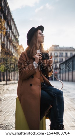 Similar – Long hair girl with hat and sunglasses walking in Sydney city streets in Australia.