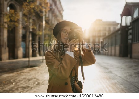 Similar – Long hair girl with hat and sunglasses walking in Sydney city streets in Australia.