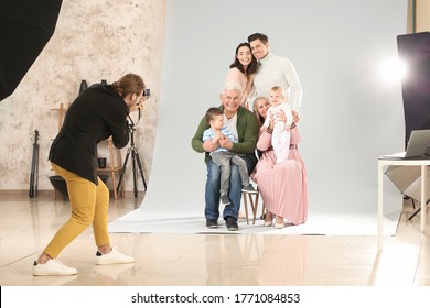 Photographer Working With Family In Studio