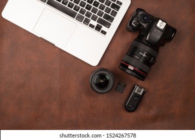 Photographer workplace with dslr camera, flash, computer and gra - Powered by Shutterstock