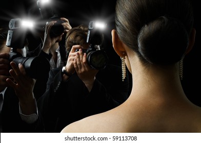 Photographers Are Taking A Picture Of A Film Star